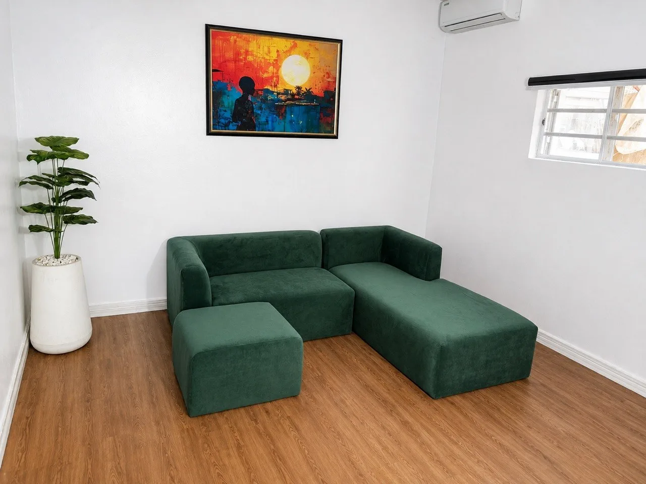 Modern smooth-surface sectional sofa with a clean contemporary design in a stylish living room